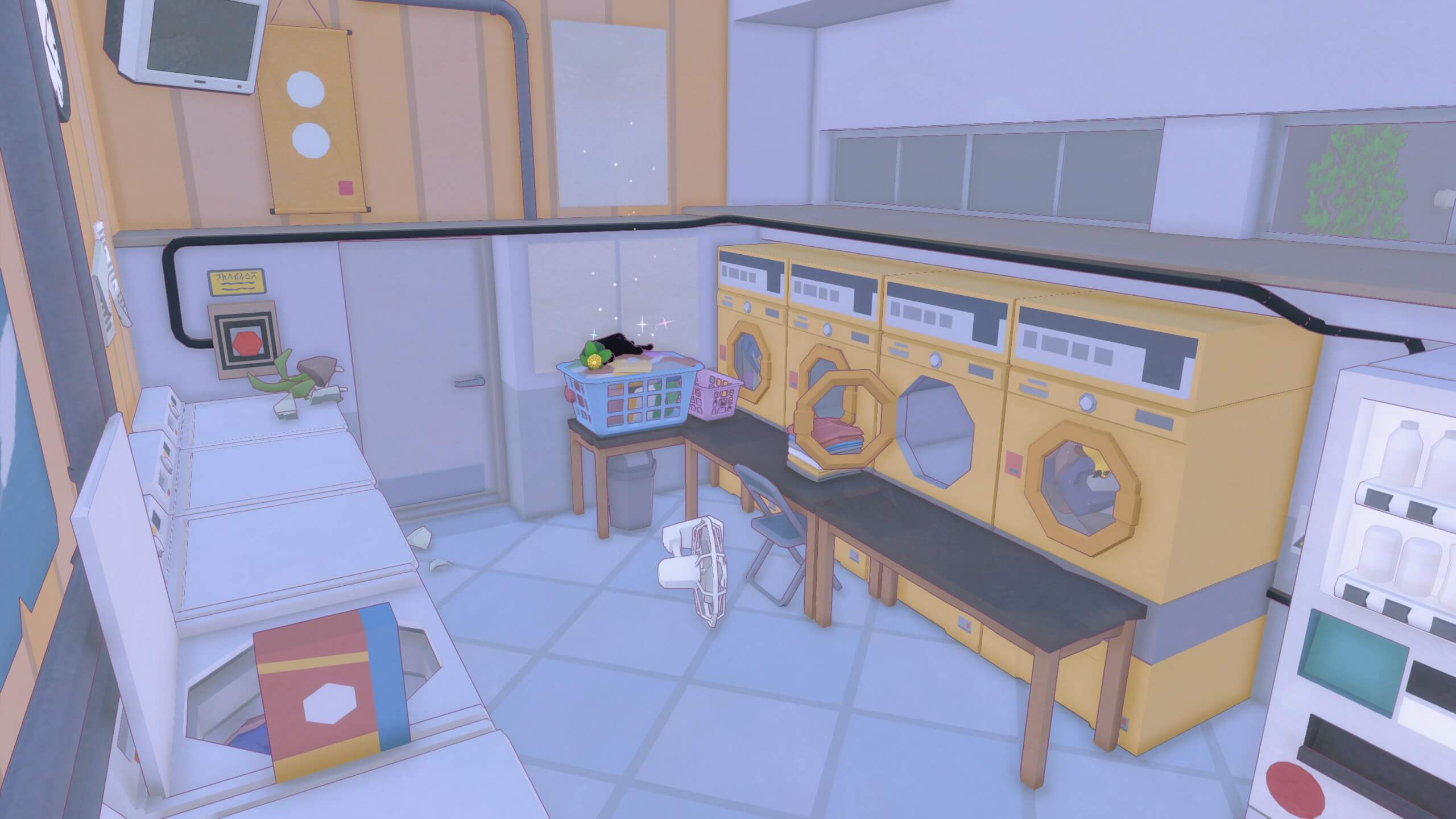 The kitty is taking a nap on top of a washing basket of clothes inside a launderette. There are 4 yellow machines on the right and 4 white machines on the left.