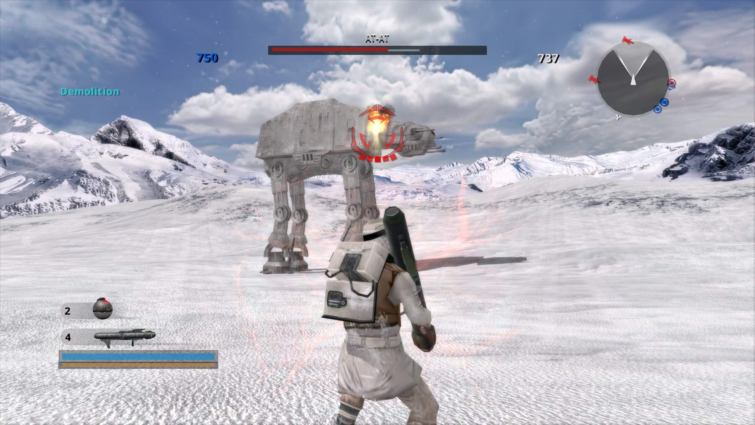 The player character is firing a rocket at the neck of a AT-AT standing on the snow. The rocket has exploded on impact and the demolition medal title has appeared on the left of the screen.