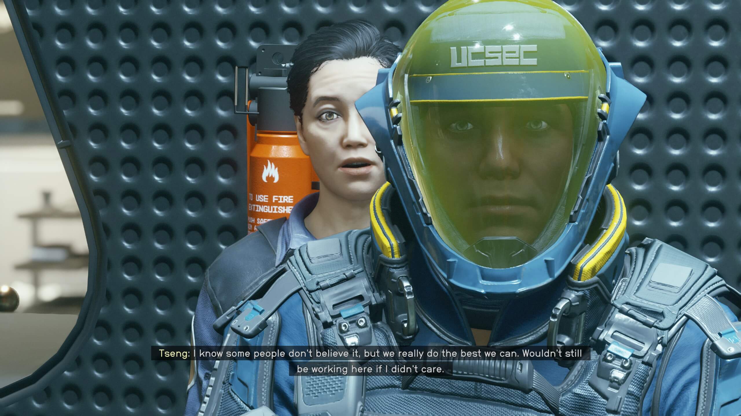 The player is in conversation with a black-haired lady called Tseng. A USEC officer is funnily standing in between them staring at the player.