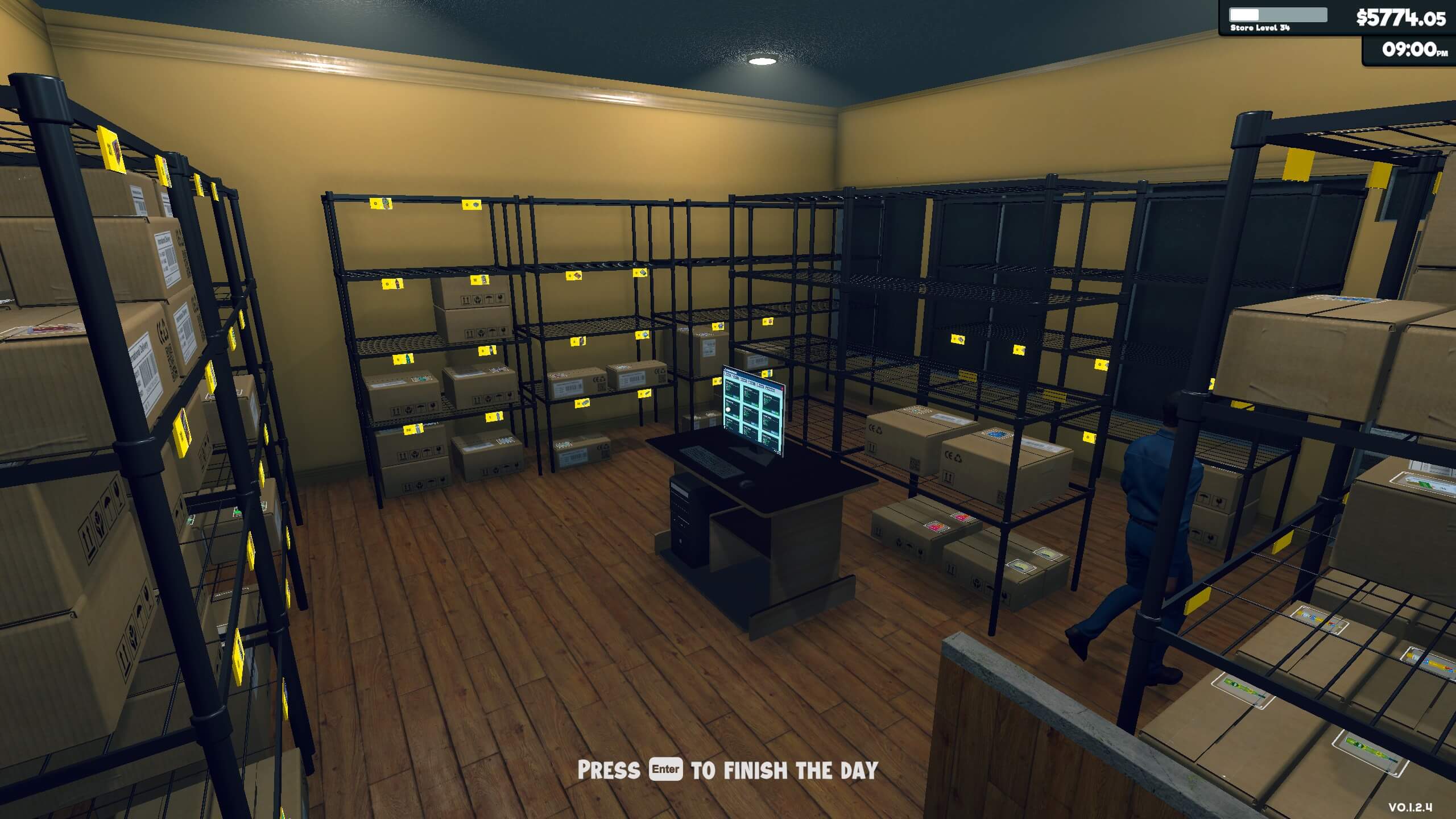 A half-empty storage room with shelves of cardboard boxes, and a computer in the middle of the room. There is a restocker walking out of the room.