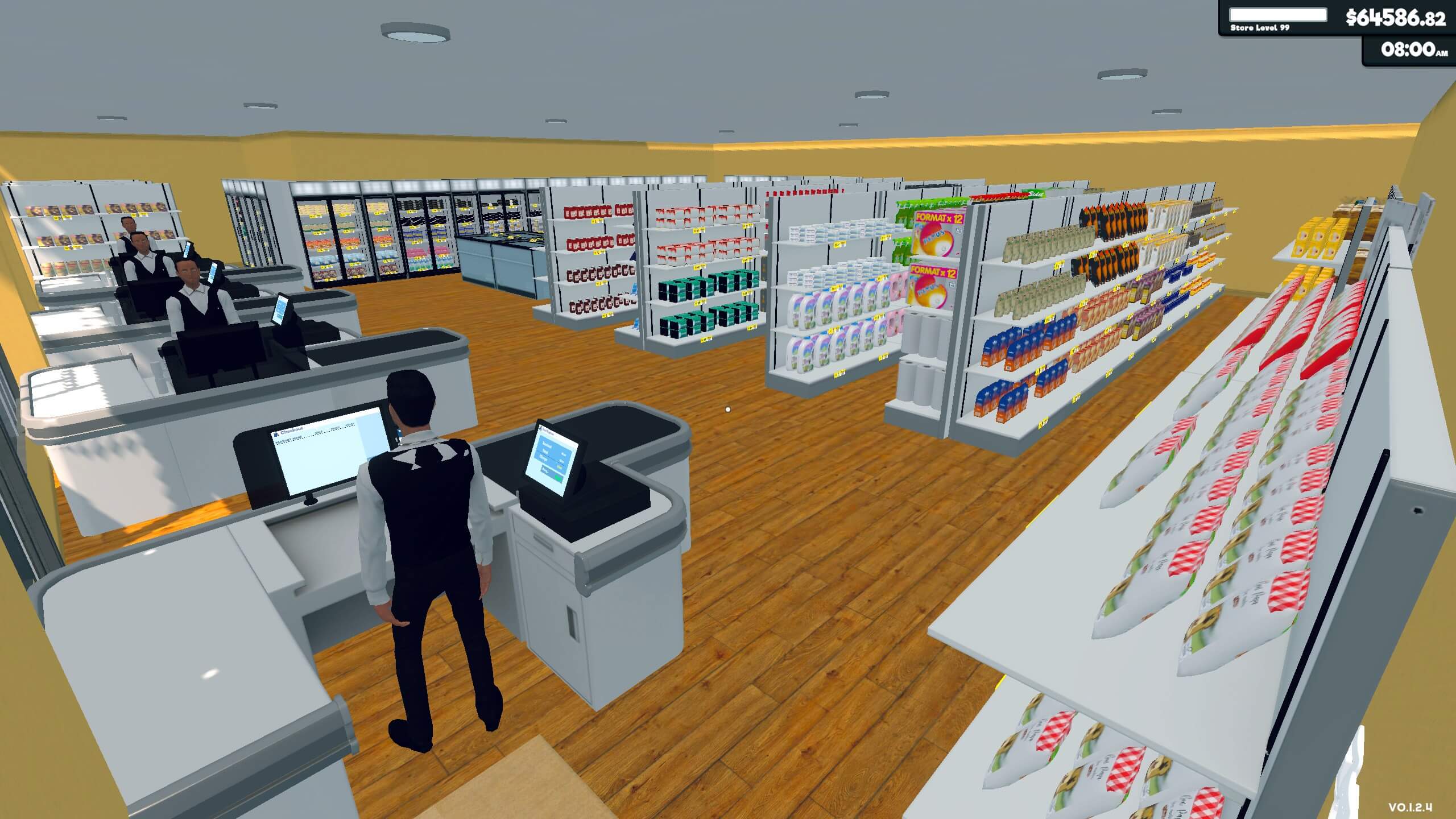 A very large supermarket before the shop has opened. 4 cashiers stand ready at the checkouts with the shelves fully stocked.